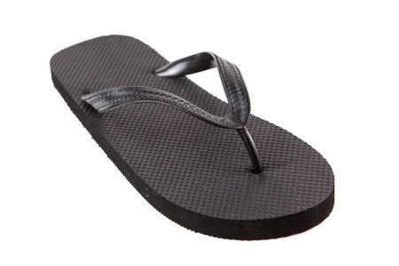 Black flip-flops isolated against a white backgroundの写真素材