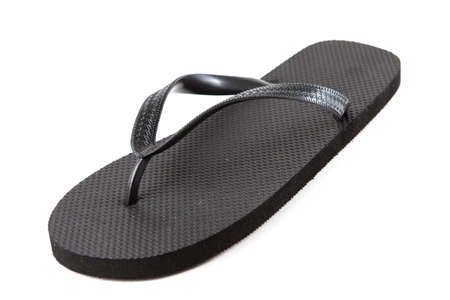 Black flip-flops isolated against a white backgroundの写真素材
