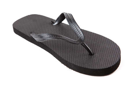 Black flip-flops isolated against a white backgroundの写真素材