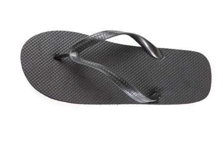 Black flip-flops isolated against a white backgroundの写真素材