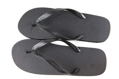 Black flip-flops isolated against a white backgroundの写真素材