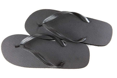 Black flip-flops isolated against a white backgroundの写真素材