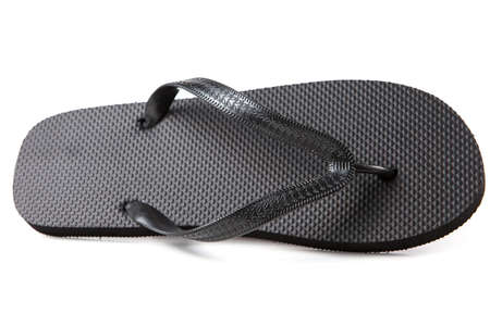 Black flip-flops isolated against a white backgroundの写真素材
