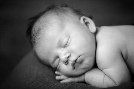 newborn baby girl sleepingの写真素材