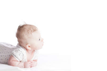 Cute infant girl on white backgroundの写真素材
