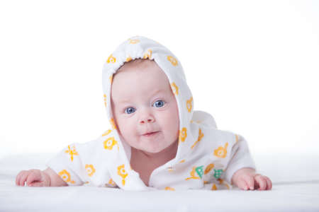Cute infant girl in hood on white の写真素材