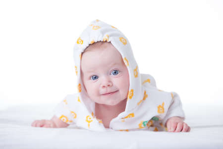 Cute infant girl in hood on white の写真素材