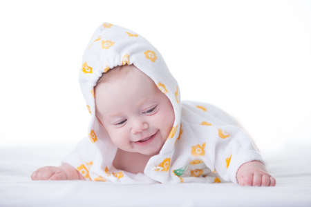 Cute infant girl in hood on white の写真素材