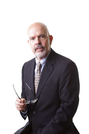 businessman in dark blue suit, holding glasses  isolated on white backgroundの写真素材