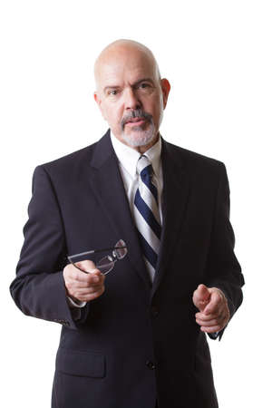 businessman in dark blue suit, holding glasses  isolated on white backgroundの写真素材