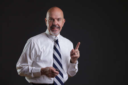 Businessman in white shirt and big strip tie i have got idea lookの写真素材