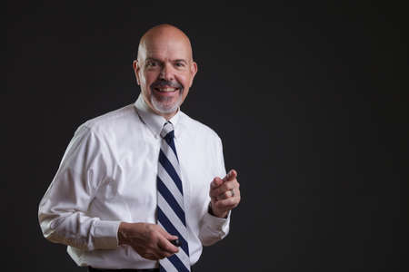 Businessman in white shirt and big strip tie i have got idea lookの写真素材