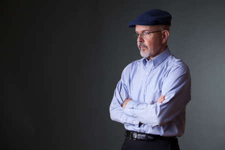 gentleman in shirt and  hat looking awayの写真素材