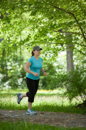Young wonam running in the parkの写真素材
