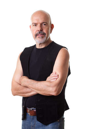 Mature biker fold his hands, smiling, isolated on whiteの写真素材