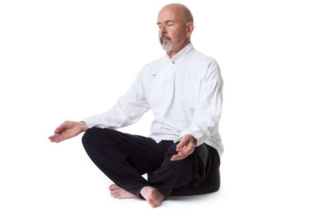 Mature male doing yoga/meditation, close up shot of hands isolated on whiteの写真素材