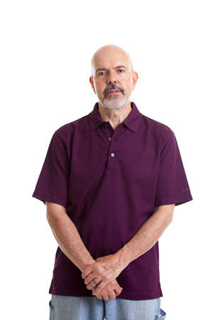 Portrait of mature man in purple polo shirt isolated on whiteの写真素材