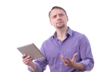 Man holding a tablet, funny expression, isolated on whiteの写真素材