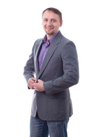 Man buttoning suit jacket, isolated on whiteの写真素材