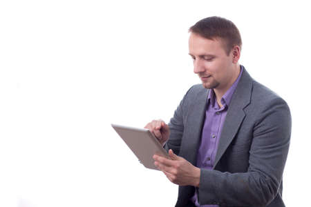 Man in suit, holding tablet, isolated on white