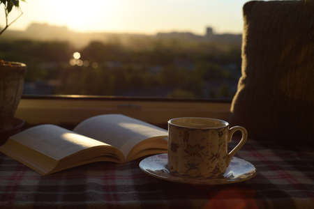 Saint Petersburg, St Petersburg, Russia, 07.07.2020. A porcelain cup of coffee stands on a plaid, a...
