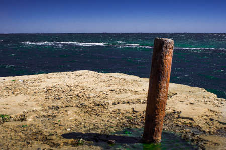 Stown pier, exotic sea and a blue sky. Beautiful summer background. Vacation and traveling concept.の写真素材