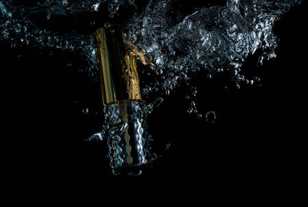 Perfume bottle and water splash smartly, begun, wave, macro
