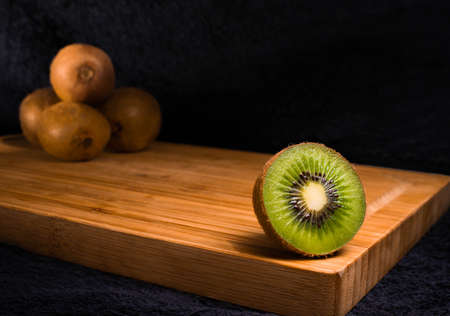 Delicious fresh kiwi fruit on a chopping board vitaminの写真素材