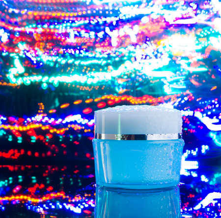 cream with fresh flowers, cosmetic, water, nightの写真素材