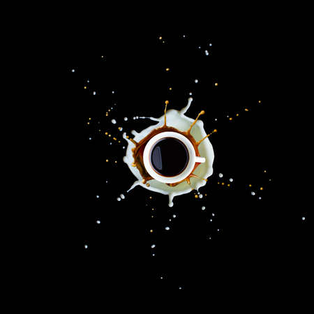 Splash of coffee and milk in white cup