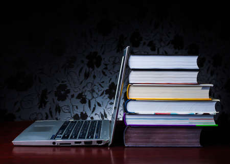 School books on desk, education concept, educate, technology, cat, splash business laptop computerの写真素材