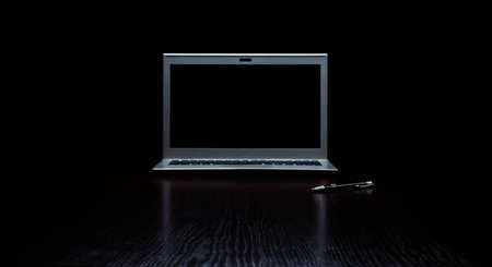 notebook or notepad blank with a pen on top and laptop put on right side, It has been on office desk for work, business concept.の写真素材