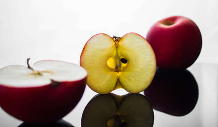 fresh red apple with droplets of water against black background diet, eat, food reflection drops...