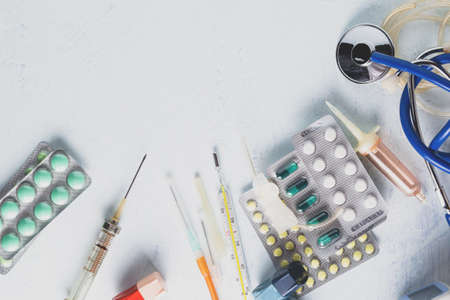 Medical tools and medicines on a white background