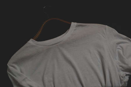 Men's t-shirt in white on a black backgroundの写真素材