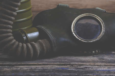 Old gas mask on wood backgroundの写真素材