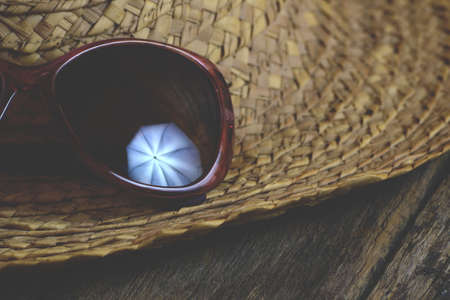 Vintage straw hat and sunglassesの写真素材