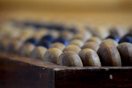 Old wooden abacus on the tableの写真素材