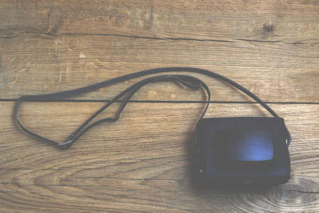 Retro camera on wood backgroundの写真素材