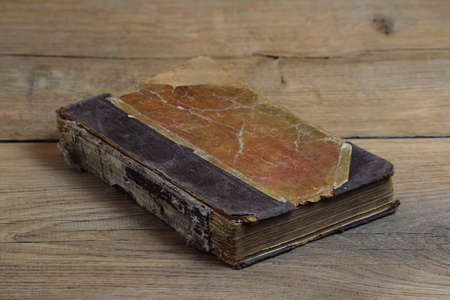 Old book on wood backgroundの写真素材