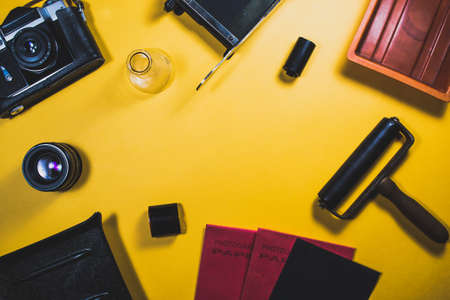 Old camera and equipment on a yellow backgroundの写真素材