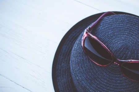 Vintage straw hat and sunglassesの写真素材