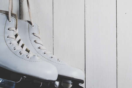 White children's skates on a white backgroundの写真素材