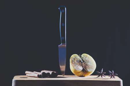 Knife and was sliced apples on a black backgroundの写真素材