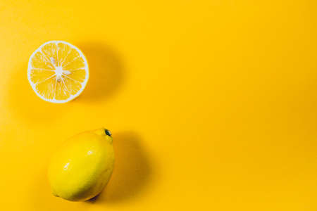 Lemons on yellow backgroundの写真素材