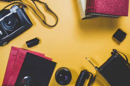 Old camera and equipment on a yellow backgroundの写真素材