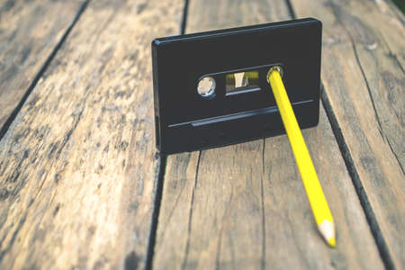 Old audiotape and pencilの写真素材