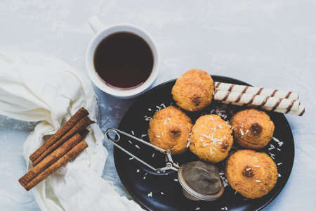 Tea and homemade cakes on a light backgroundの写真素材