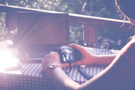 Girl working with notebook in the gardenの写真素材