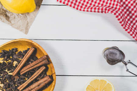 Lemons and spices on a light wooden background. Tea setの写真素材